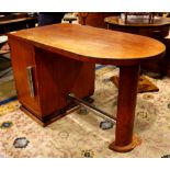 French Art Deco desk, having a rectangular top with crescent edge above the single door with a
