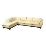 Roche Bobois sectional sofa, executed in cream italian leather, having a wood seat rail, and