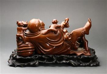 Chinese wooden sculpture, of reclining Budai holding a bat and jewel, surrounded by five playful - Image 2 of 3