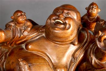 Chinese wooden sculpture, of reclining Budai holding a bat and jewel, surrounded by five playful - Image 3 of 3