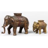 (lot of 2) Cast iron elephant penny/still banks, each depicted with a howdah, one retains original
