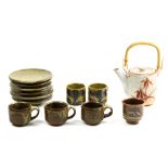 (lot of 7) Japanese Hagi teapot decorated with irises; six tea cups, three of with handles, along