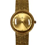 Baume & Mercier 14k yellow gold wristwatch Dial: round, gold, sunburst, applied gold baton hour