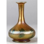 Miniature Tiffany Studios Favrile stick neck vase, executed in gold aurene with green heart accents,