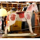 Folk Art wooden toy horse, having polychrome detail, 21"h x 22"l