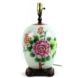Chinese enameled porcelain jar, mounted as a lamp, featuring large pink and blush colored peonies on