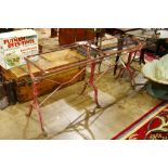 French double length trestle table, circa 1900, with red painted cast iron base, and later glass