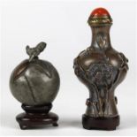 (lot of 2) Chinese metal snuff bottles, the first a peach form pewter bottle; the second, of