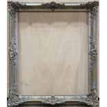 Rococo style frame, painted silver with gold accents, 3'7''h x 3'1''w.