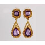 Pair of amethyst and 18k yellow gold earrings Featuring (2) cushion-cut and (2) pear-cut amethyst,