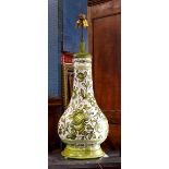 Mid Century ceramic table lamp, circa 1950, having a bulbous base with green floral decoration on
