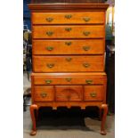 American Chippendale maple high boy, having a four drawer top, each with a tiger maple front,