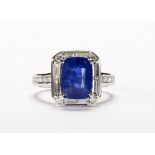 Sapphire, diamond and 14k white gold ring Featuring (1) rectangular cushion-cut sapphire, weighing