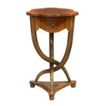 French occasional table, circa 1900, having a shaped top above the conforming case with a single