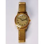 14k yellow gold and metal wristwatch Dial: round (discolored), Arabic numeral hour markers, black