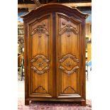 French Baroque walnut armoire, Lyon, 1700's, having a molded cornice above two paneled doors, each