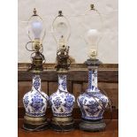 (lot of 3) Chinese style stoneware table lamps, each executed in blue and white, 25.5"h