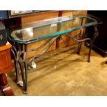 Moderne style console table, the beveled edged glass top over the metal frame and rising on legs