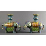 Pair of Chinese cloisonne enameled vessels, each of a carparisoned elephant supporting a gu-vase