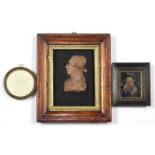 (lot of 3) Neoclassical style framed silhouette reliefs, comprising (2) wax reliefs, one depicting