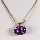 Amethyst and yellow gold pendant-necklace Featuring (1) oval-cut amethyst, weighing approximately