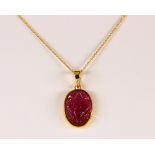 Tourmaline and 18k yellow gold pendant-necklace Featuring (1) carved oval foliate motif