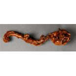 Chinese boxwood ruyi scepter, the head carved with a large persimmon issuing from the scepter in the