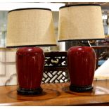 Pair of Chinese ox blood glazed porcelain jars, mounted as lamps, with a tapering ovoid body