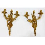 Louis XV style gilt bronze wall sconces, the two light fixtures with acanthus and floral scrolls