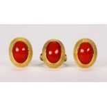 Coral and 18k yellow gold jewelry suite Including 1) pair of earrings, featuring (2) oval coral