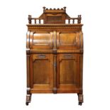 American Wooten Queen Anne Pattern three hinge patent desk circa 1885 executed in walnut, the