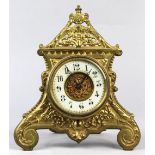 English Rococo style desk clock, having a brass architectural body with a white enamel dial, 10"h.