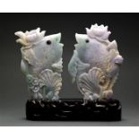 Pair of Chinese of jadeite fish, each topped with a lotus blossom on its head, and set into one wood