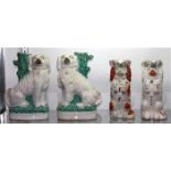 (lot of 4) Staffordshire style pottery figural group, consisting of a pair of spaniel slip vases,