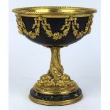Continental style gilt bronze footed compote, having a garland swag decorated frieze flanking the