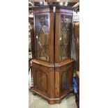 Pair of Federal or Chippendale style corner cabinets, each with a mullioned glass panel door above