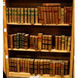 Three shelves of leather bound books mostly relating to literature and history, including an early