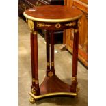 Empire style round console table, executed in mahogany with faux gilt mounts, the three legs