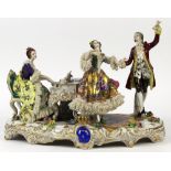 German porcelain figural group, depicting a pianist and dancers, each dressed in classical attire