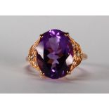 Amethyst, diamond and 14k rose gold ring Featuring (1) oval-cut amethyst, weighing approximately 8.