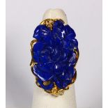 Carved lapis lazuli and 14k yellow gold ring Featuring (1) carved lapis lazuli cabochon, measuring