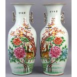 Pair of Chinese porcelain vases, each of baluster form with large peonies to the right of a