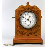French Edwardian Mantle clock, the wooden case framing a white enamel dial with Arabic numberals and