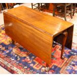 Chippendale walnut drop leaf table, having a rectangular top and rising on claw and ball feet,