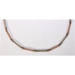 Gold watch chain The 10k rose and white gold, elongated links, measure approximately 3.3 mm in