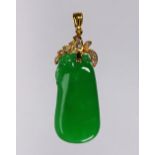 Jadeite, diamond and 18k yellow gold pendant Featuring (1) carved jadeite plaque, measuring