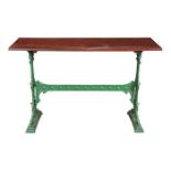 Antique French cafe table, having a painted green metal tressel base and a fruitwood rectangular
