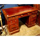 Edwardian lawyer's kneehole desk, having and inset tooled red leather top above 9 drawers, 30"h x