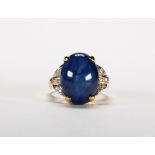 Star sapphire, diamond and 18k yellow gold ring Featuring (1) oval star sapphire, measuring