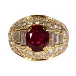 Ruby, diamond and 14k yellow gold ring Centering (1) oval-cut ruby, weighing approximately 2.60
